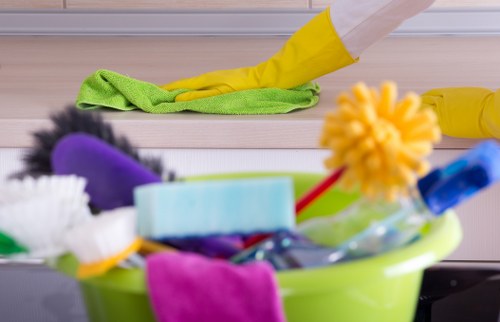 Professional cleaner in Putney handling a tidy residential cleaning task