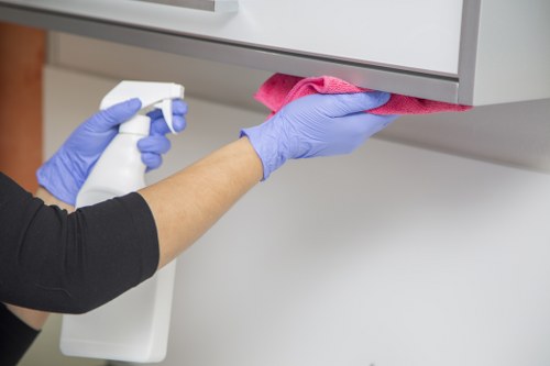 Cleaner reviewing equipment checks and workplace safety steps